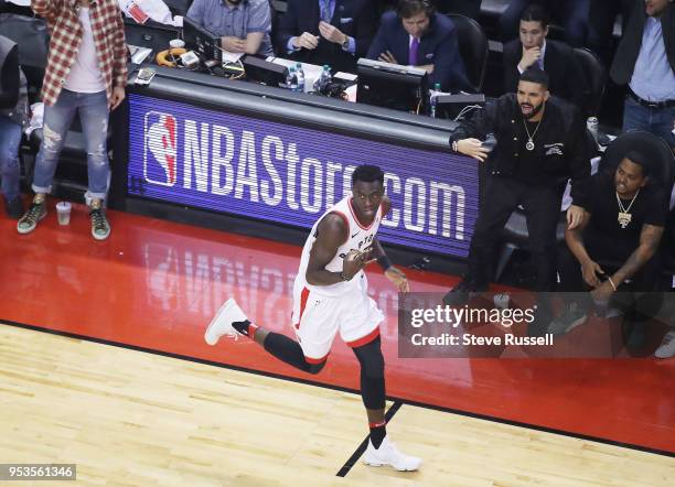 Drake celebrates after Toronto Raptors forward Pascal Siakam hits a three pointer as the Toronto Raptors play the Cleveland Cavaliers in game 1 of...