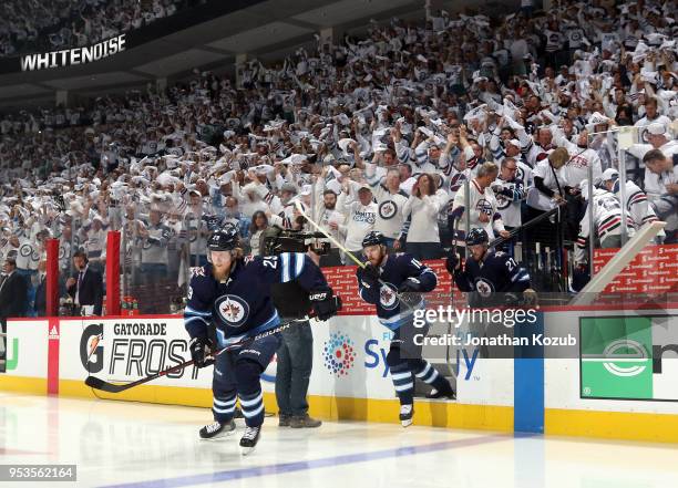 Patrik Laine, Bryan Little and Nikolaj Ehlers of the Winnipeg Jets hit the ice prior to puck drop against the Nashville Predators in Game Three of...