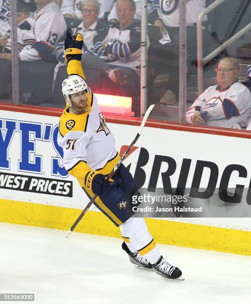Austin Watson of the Nashville Predators celebrates scoring past Connor Hellebuyck of the Winnipeg Jets in Game Three of the Western Conference...