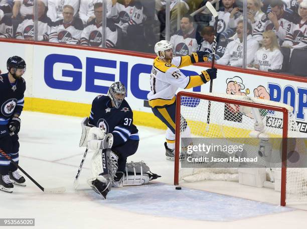 Austin Watson of the Nashville Predators celebrates scoring past Connor Hellebuyck of the Winnipeg Jets in Game Three of the Western Conference...