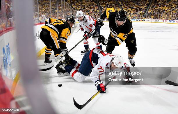 Oshie of the Washington Capitals battles Brian Dumoulin of the Pittsburgh Penguins for the puck in Game Three of the Eastern Conference Second Round...