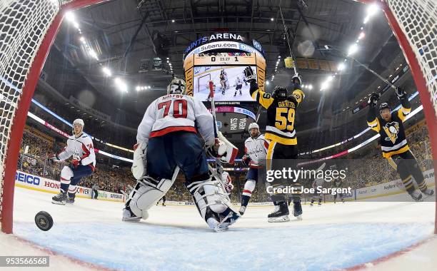 Jake Guentzel of the Pittsburgh Penguins scores past Braden Holtby of the Washington Capitals in the second period in Game Three of the Eastern...