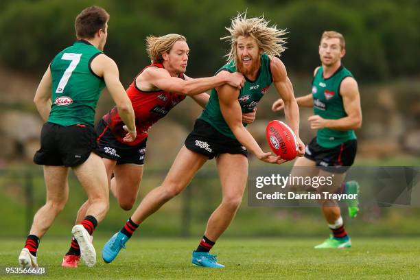Dyson Heppell handballs during an Essendon Bombers Training Session on May 2, 2018 in Melbourne, Australia.
