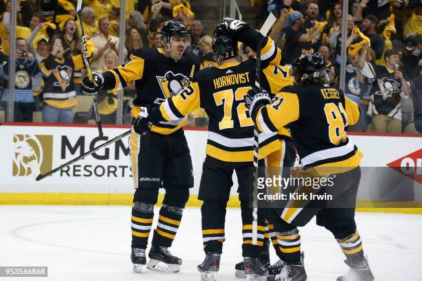 Patric Hornqvist of the Pittsburgh Penguins is congratulated by his teammates after scoring a power play goal during the second period in Game Three...