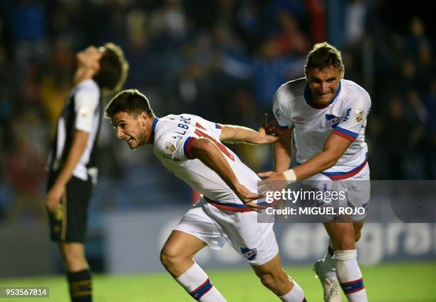 Uruguay's Nacional player Leandro Barcia celebrates with Gonzalo Bergessio after scoring against Brazil's Santos during their Copa Libertadores...