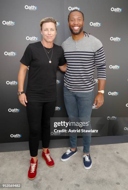 Soccer player Abby Wambach and NFL player Larry Fitzgerald attend Oath NewFront at Pier 26 on May 1, 2018 in New York City.