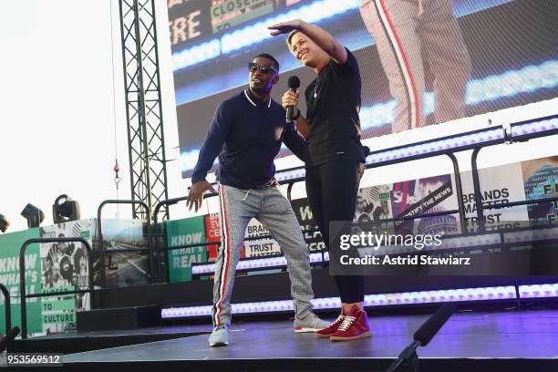 Actor Jamie Foxx and soccer player Abby Wambach speak onstage during the stage during Oath NewFront at Pier 26 on May 1, 2018 in New York City.