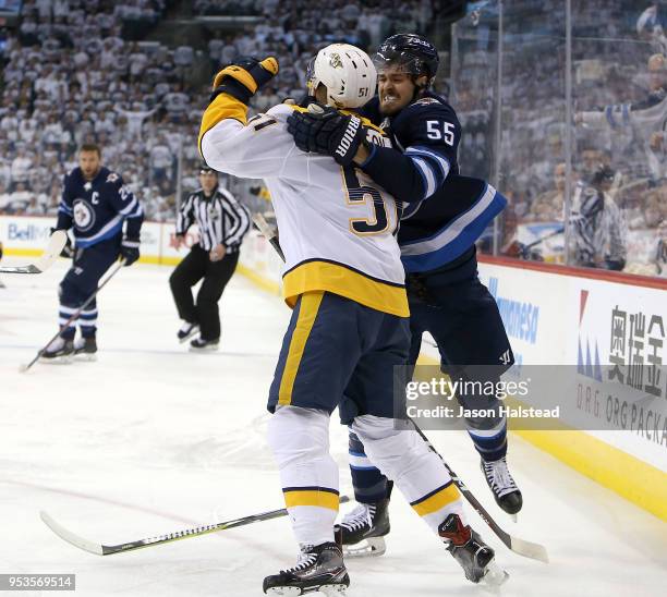 Mark Scheifele of the Winnipeg Jets battles Austin Watson of the Nashville Predators in Game Three of the Western Conference Second Round during the...