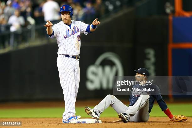 Todd Frazier of the New York Mets reacts after making it safely to second base on a single hit by Adrian Gonzalez in the ninth inning against the...