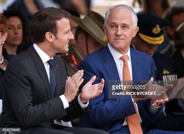 French President Emmanuel Macron and Australian Prime Minister Malcolm Turnbull clap during war commemorative ceremony in Sydney on May 2, 2018. -...