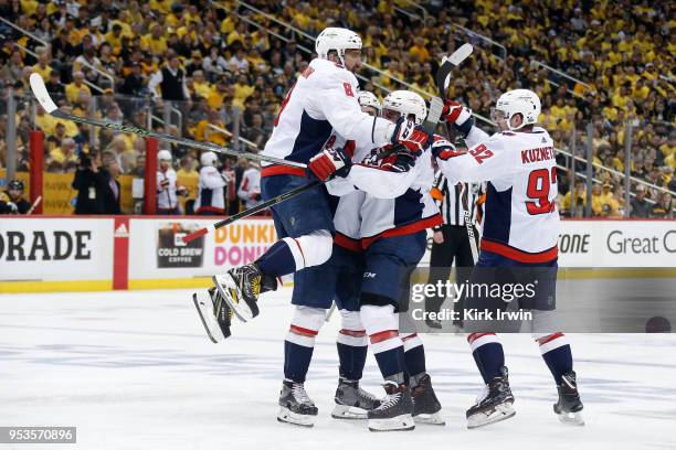 Alex Ovechkin of the Washington Capitals congratulates Matt Niskanen of the Washington Capitals after scoring a goal during the third period in Game...