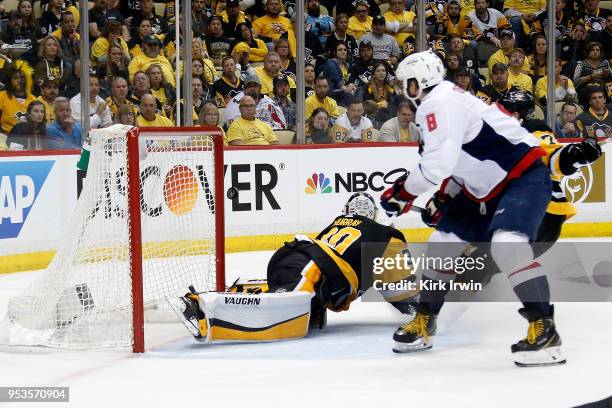 Alex Ovechkin of the Washington Capitals flips the puck past Matt Murray of the Pittsburgh Penguins for the game winning goal during the third period...