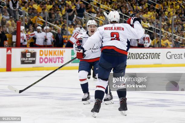 Dmitry Orlov of the Washington Capitals congratulates Matt Niskanen of the Washington Capitals after scoring a goal during the third period in Game...