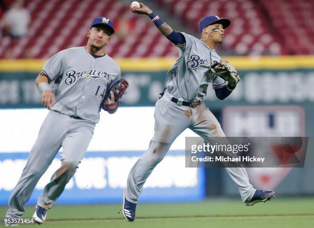 Orlando Arcia of the Milwaukee Brewers throws to first to make the final out against the Cincinnati Reds at Great American Ball Park on May 1, 2018...