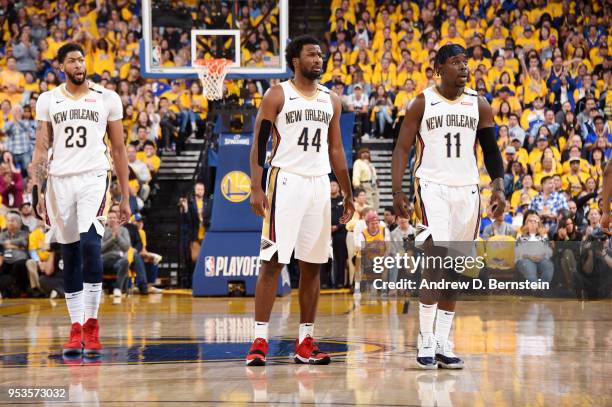 Anthony Davis and Solomon Hill and Jrue Holiday of the New Orleans Pelicans look on during Game Two of Round Two of the 2018 NBA Playoffs against the...