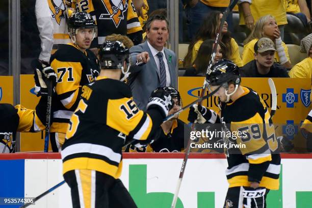 Head coach Mike Sullivan of the Pittsburgh Penguins yells out instructions to Riley Sheahan of the Pittsburgh Penguins during the second period in...