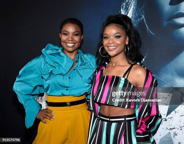 Cast members Gabrielle Union and Ajiona Alexus pose during Universal Pictures' special screening of the film "Breaking In" at ArcLight Cinemas on May...