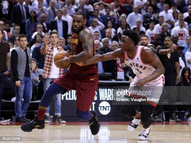 LeBron James of the Cleveland Cavaliers dribbles the ball as OG Anunoby of the Toronto Raptors defends in the second half of Game One of the Eastern...