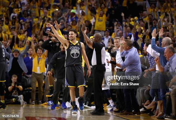 Klay Thompson of the Golden State Warriors reacts after he made a three-point basket at the end of the first half against the New Orleans Pelicans...