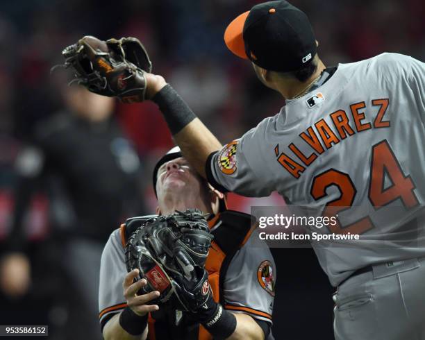 Baltimore Orioles catcher Chance Sisco takes an elbow to the head from third baseman Pedro Alvarez while Alvarez catches a foul ball in the seventh...