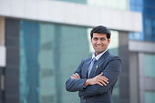 Businessman Standing With His Arms Folded - Stock image