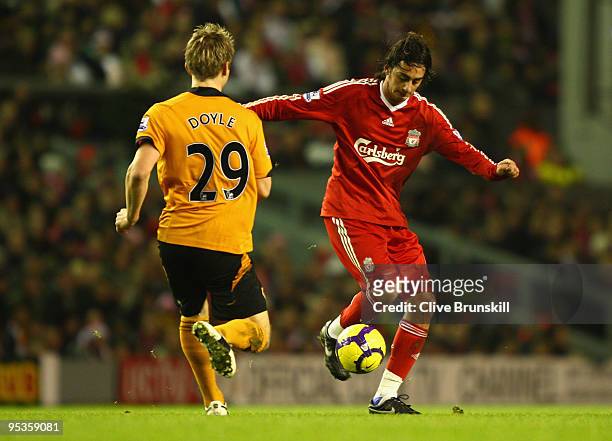 Alberto Aquilani of Liverpool controls the ball under pressure from Kevin Doyle of Wolverhampton Wanderers during the Barclays Premier League match...