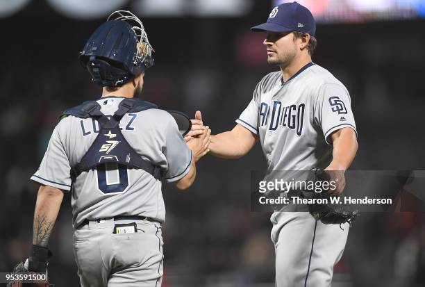 Raffy Lopez and Brad Hand of the San Diego Padres celebrates defeating the San Francisco Giants 3-2 at AT&T Park on May 1, 2018 in San Francisco,...