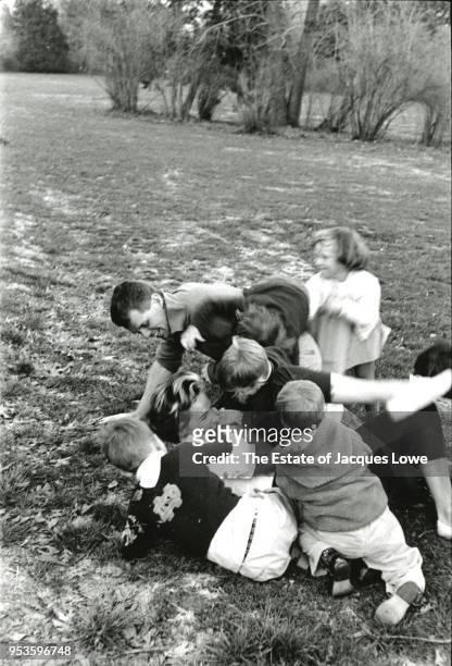 During a football game, US Attorney General Robert F Kennedy , along with fellow players made up from various Kennedy and neighborhood children,...