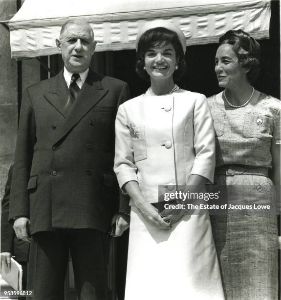 Portrait of French President Charles de Gaulle and his wife, Yvonne de Gaulle , on either side of US First Lady Jacqueline Kennedy on the steps of...