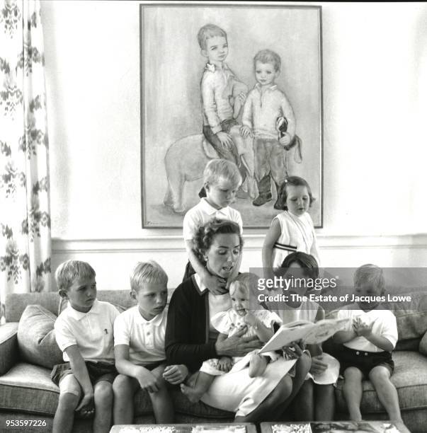 In their home, Hickey Hill, Ethel Skakel Kennedy reads to a her children as they all sit on a sofa, McLean, Virginia, early 1960s. Pictured are,...