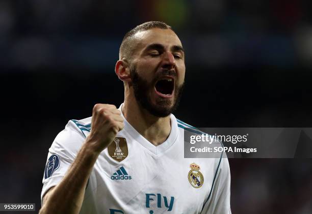 Karim Benzema celebrates after scoring a goal during the UEFA Champions League Semi Final Second Leg match between Real Madrid and Bayern Munchen at...