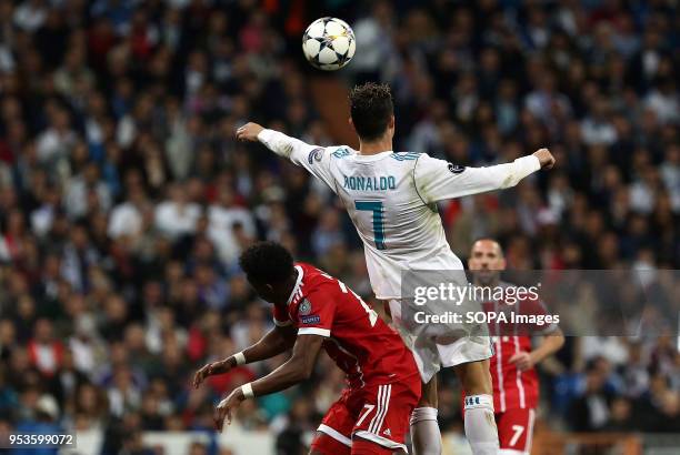 Cristiano Ronaldo competes for the ball with David Alaba during the UEFA Champions League Semi Final Second Leg match between Real Madrid and Bayern...