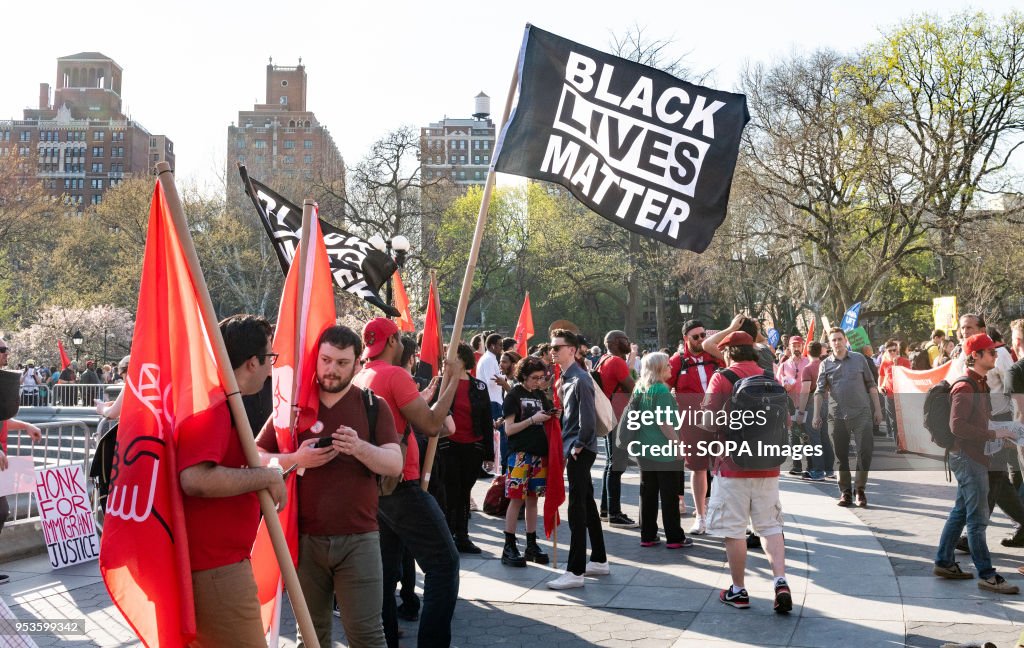 A flag bearing the slogan 'Black Lives Matter' seen during a...