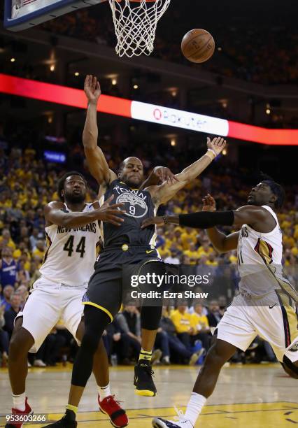 Andre Iguodala of the Golden State Warriors is fouled by Solomon Hill of the New Orleans Pelicans during Game Two of the Western Conference...