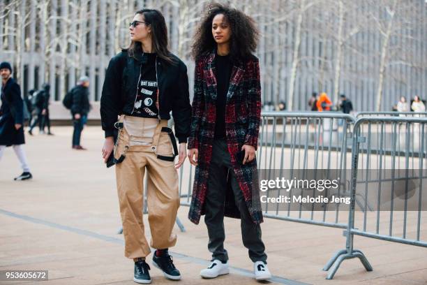 Models Vittoria Ceretti, Selena Forrest after the Michael Kors show at Lincoln Center on February 14, 2018 in New York City. Vittoria wears a cropped...