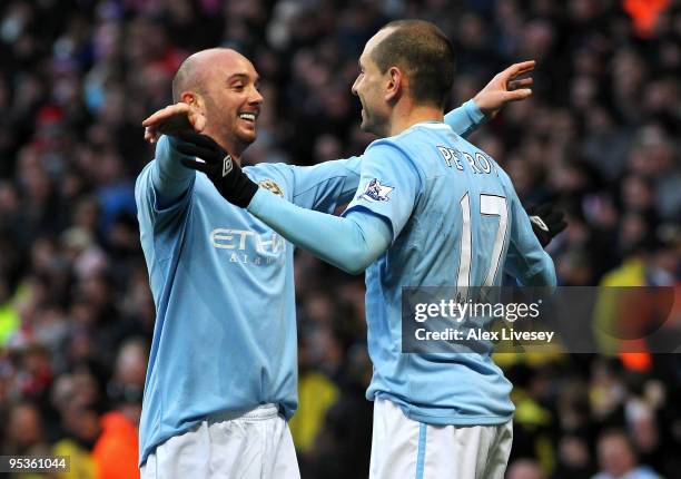 Martin Petrov of Manchester City celebrates with Stephen Ireland after scoring the first goal during the Barclays Premier League match between...