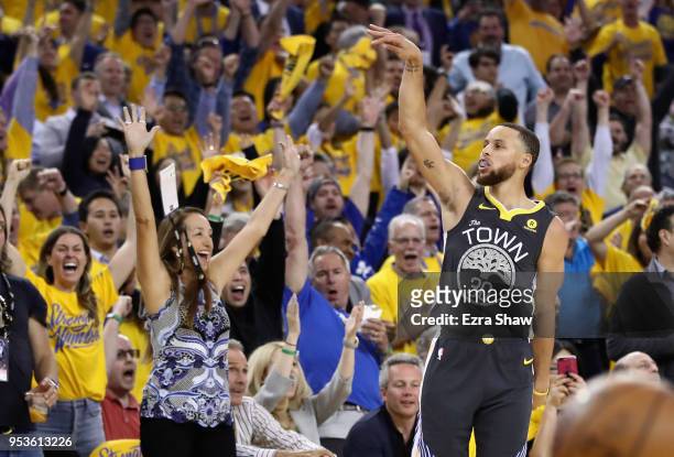 Stephen Curry of the Golden State Warriors reacts after making a three-point basket against the New Orleans Pelicans during Game Two of the Western...