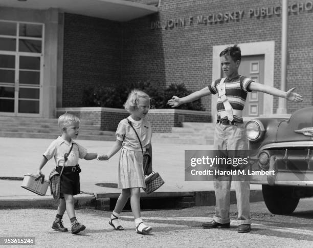 SCHOOL CHILDREN WALKING TOGETHER