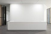 White reception in a white office lobby