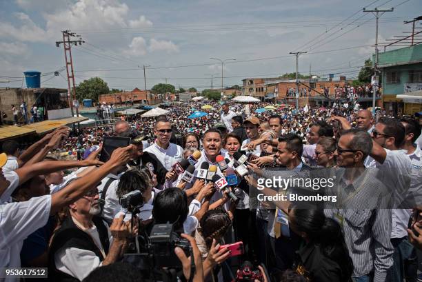Evangelical pastor Javier Bertucci, presidential candidate for the Esperanza Por El Cambio Party, center, speaks to members of the media following a...
