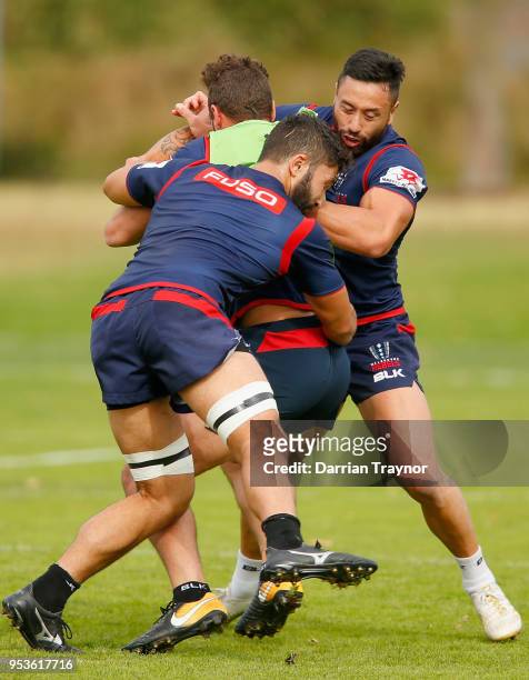 Colby Faing'a and Michael Ruru tackle Tom English during a Melbourne Rebels training at AAMI Park on May 2, 2018 in Melbourne, Australia.