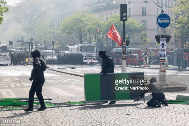 About 1200 masked and hooded protesters dressed in black attacked the police on May Day in Paris. Protesters smashed windows of businesses, torched...