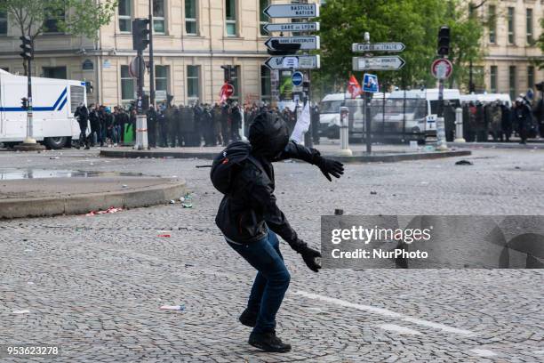 About 1200 masked and hooded protesters dressed in black attacked the police on May Day in Paris. Protesters smashed windows of businesses, torched...