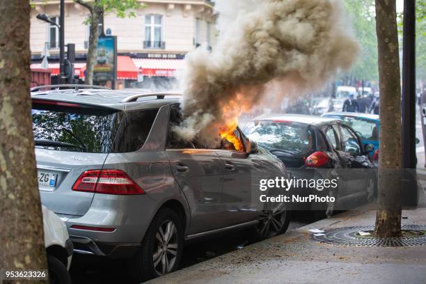 About 1200 masked and hooded protesters dressed in black attacked the police on May Day in Paris. Protesters smashed windows of businesses, torched...