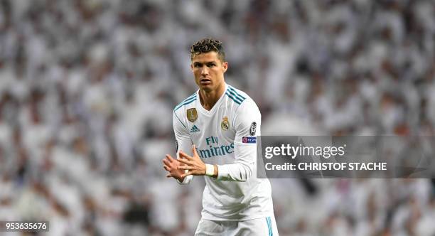 Real Madrid's Portuguese forward Cristiano Ronaldo gestures during the UEFA Champions League semi-final second-leg football match Real Madrid CF vs...