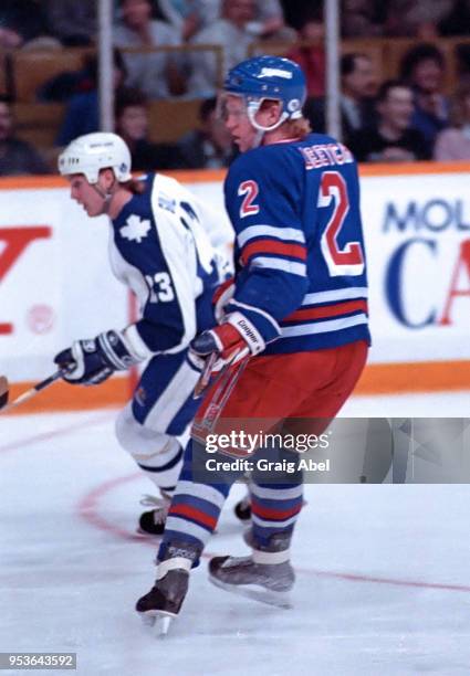 Brian Leech of the New York Rangers skates against Todd Gill of the Toronto Maple Leafs during NHL game action on January 28, 1989 at Maple Leaf...