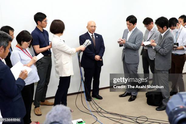 Japan Wrestling Federation Chairman Tomiaki Fukuda talks to media reporters after his meeting with Japan Sports Agency Commissioner Daichi Suzuki at...
