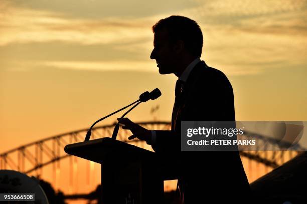 France's President Emmanuel Macron delivers a speech onboard the Australian aircraft carrier HMAS Canberra in Sydney on May 2, 2018. - Macron arrived...