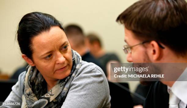 Defendant Beate Zschaepe talks with her lawyer Mathias Grasel as she waits for the continuation of her trial at a courtroom in Munich, southern...