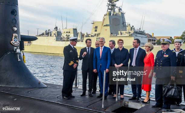 Australian Prime Minister Malcolm Turnbull , President of France Emmanuel Macron , Australian Minister for Defence Industry Christopher Pyne ,...